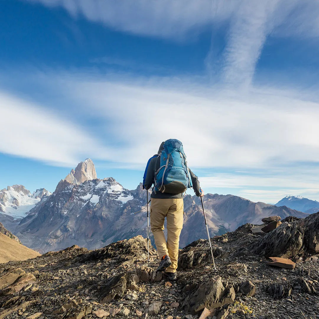 hiking in a rock trail with mountains in the background