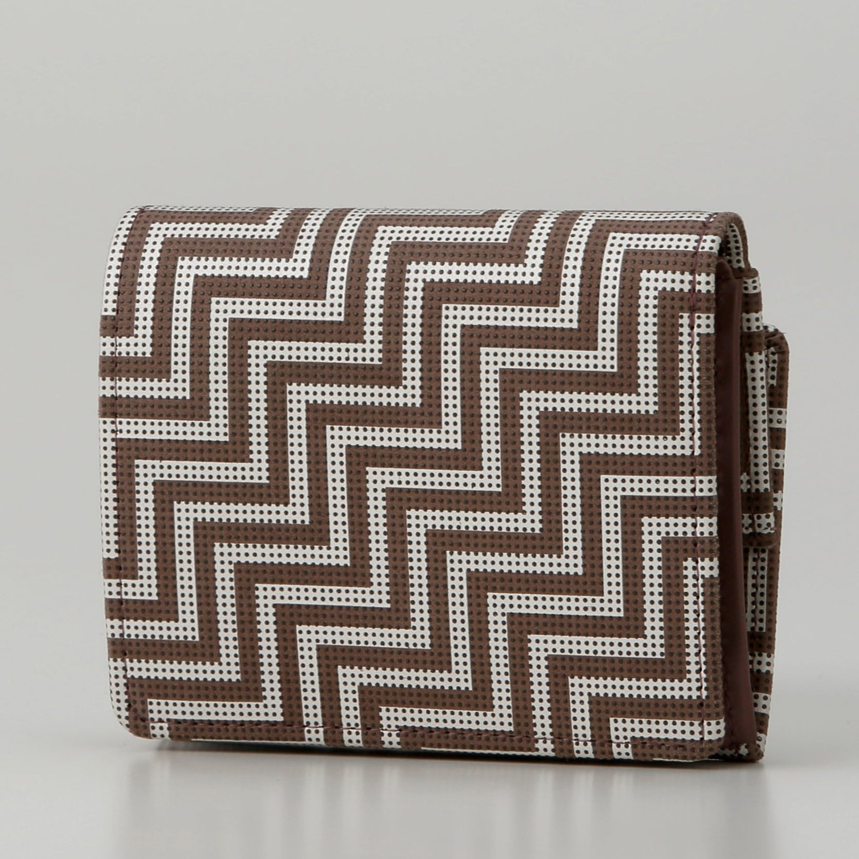Folded fabric with a zigzag pattern on a white background