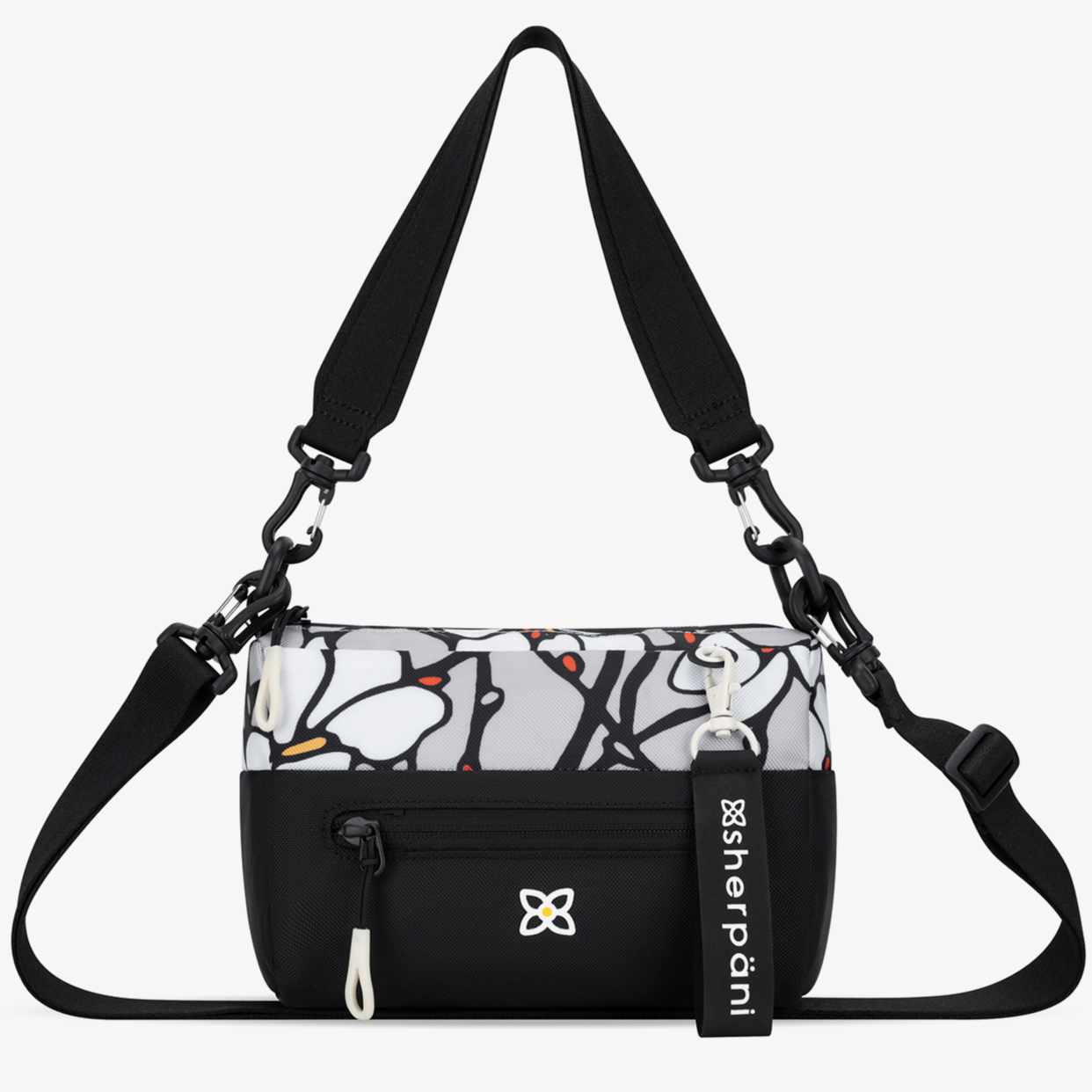 Black crossbody bag with a patterned compartment and visible Sherpani branding on a white background