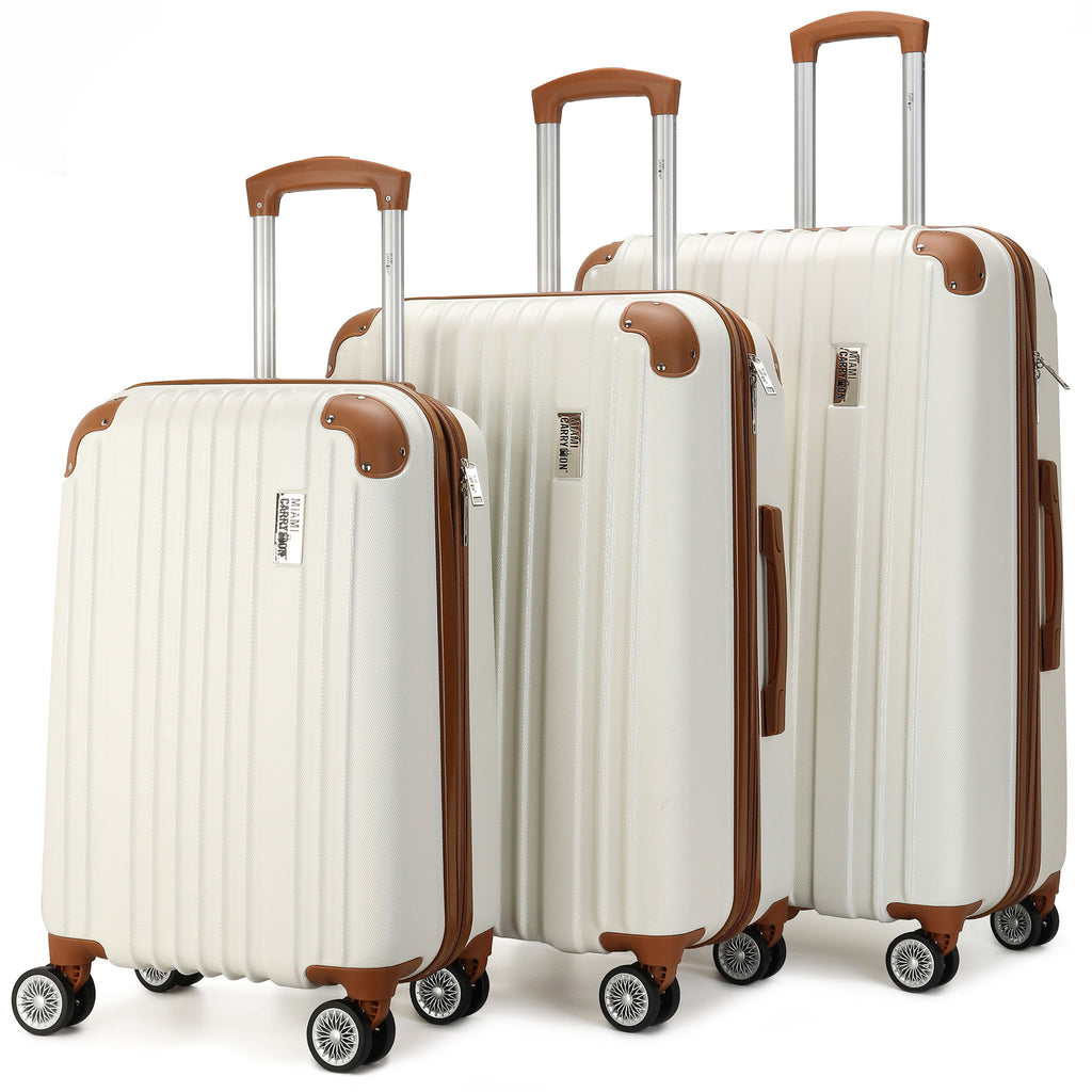 white luggage 3 piece set with brown accents and corner guards