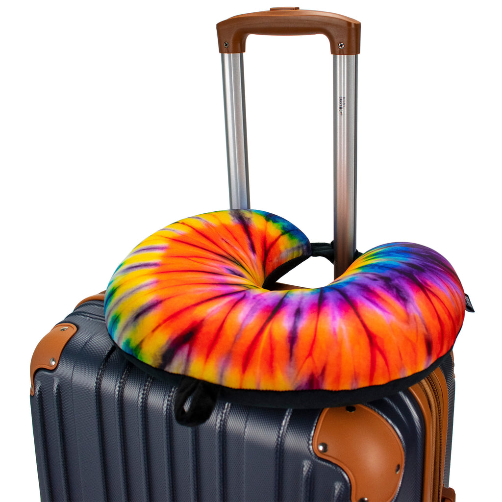 tie dye neck pillow on luggage handle