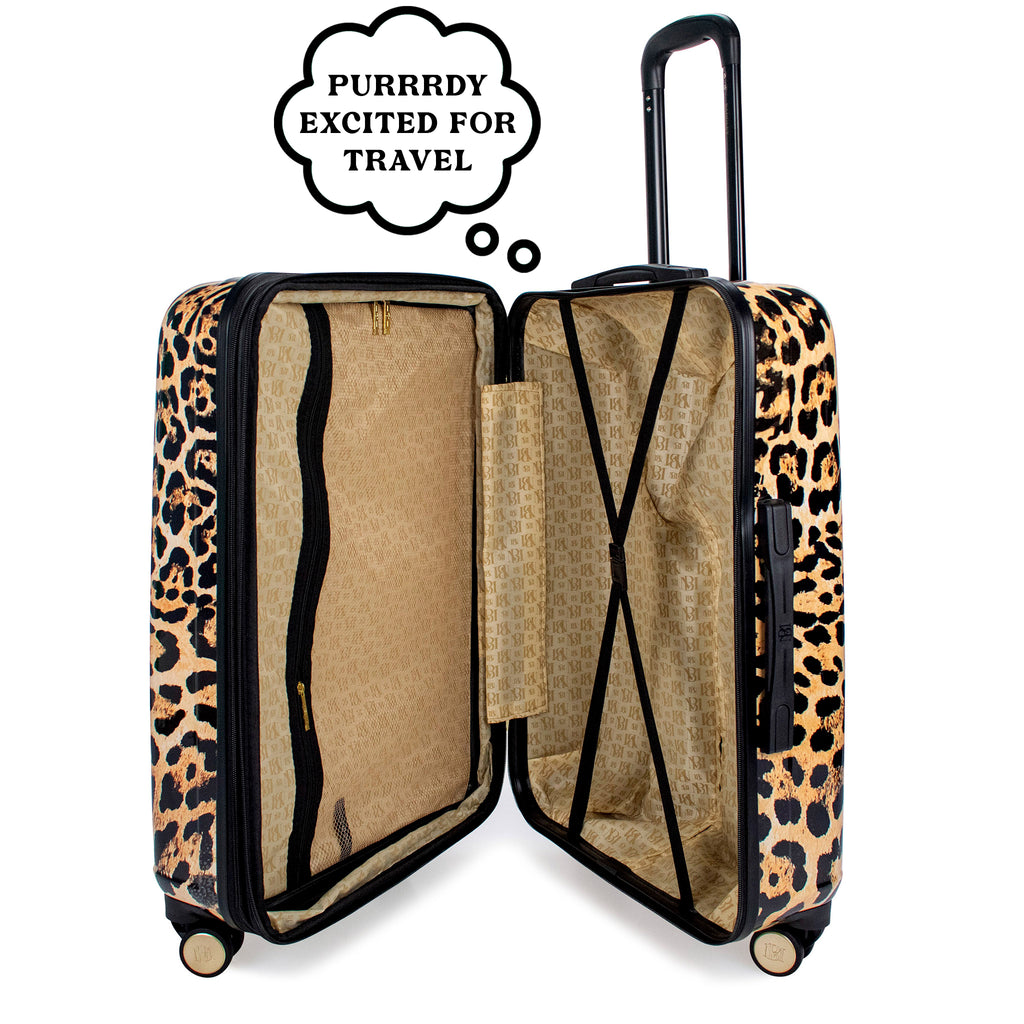 leopard print luggage that has a thought bubble that says "purrrdy excited for travel"