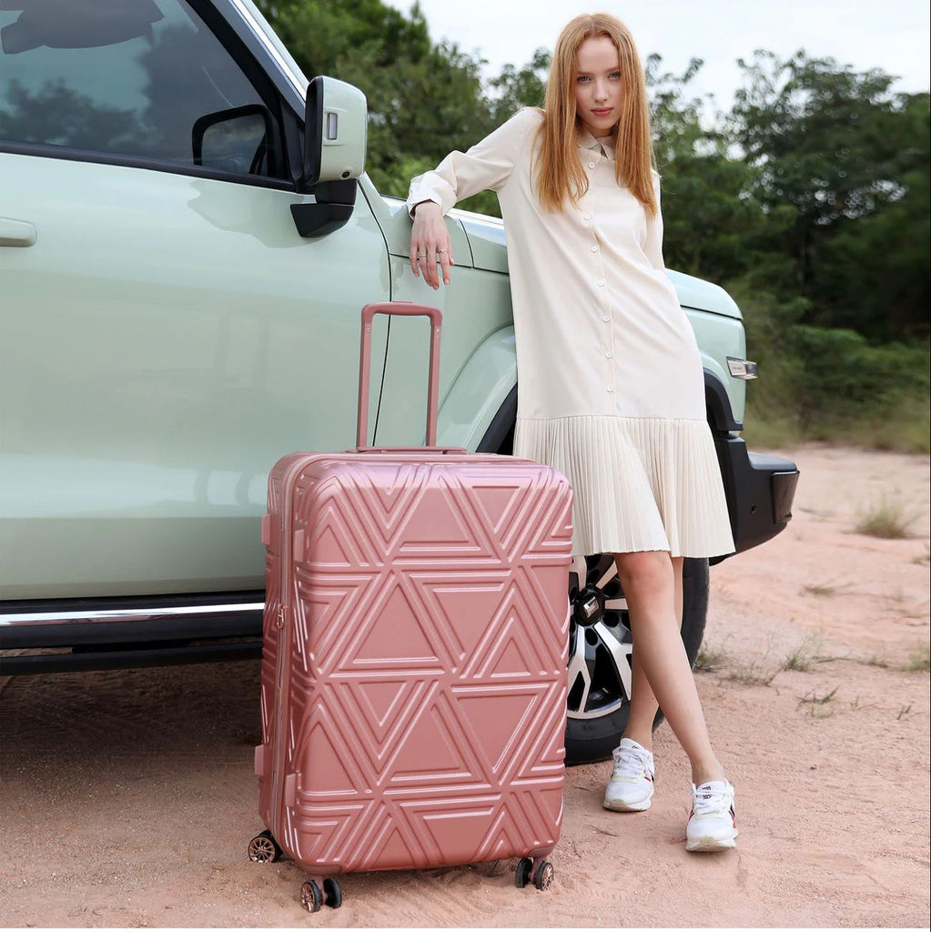 woman with pink luggage