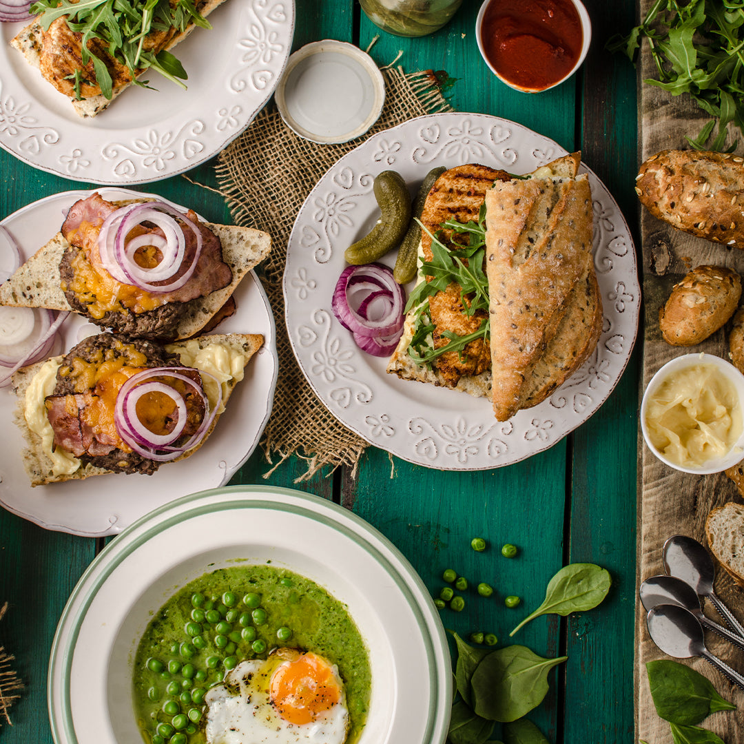 Assorted food spread out on a green table with delicious ingredients