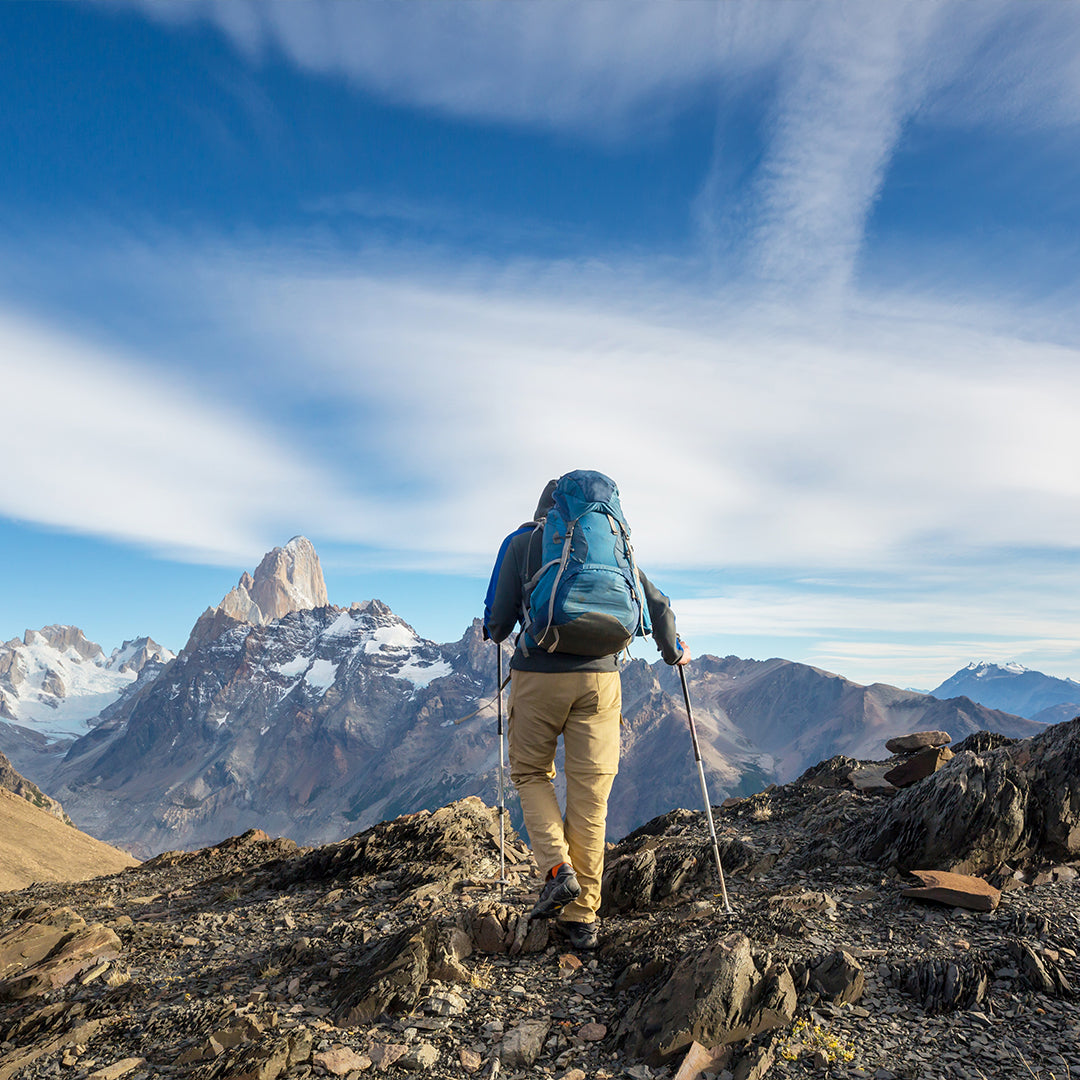 hiking in a rock trail with mountains in the background