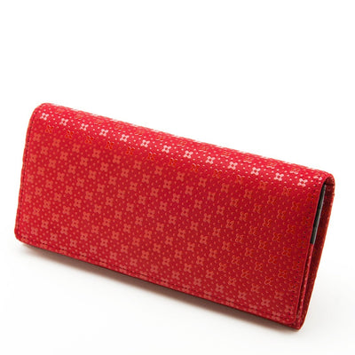 Red textured wallet on a white background