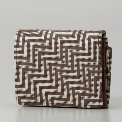 Folded fabric with a zigzag pattern on a white background