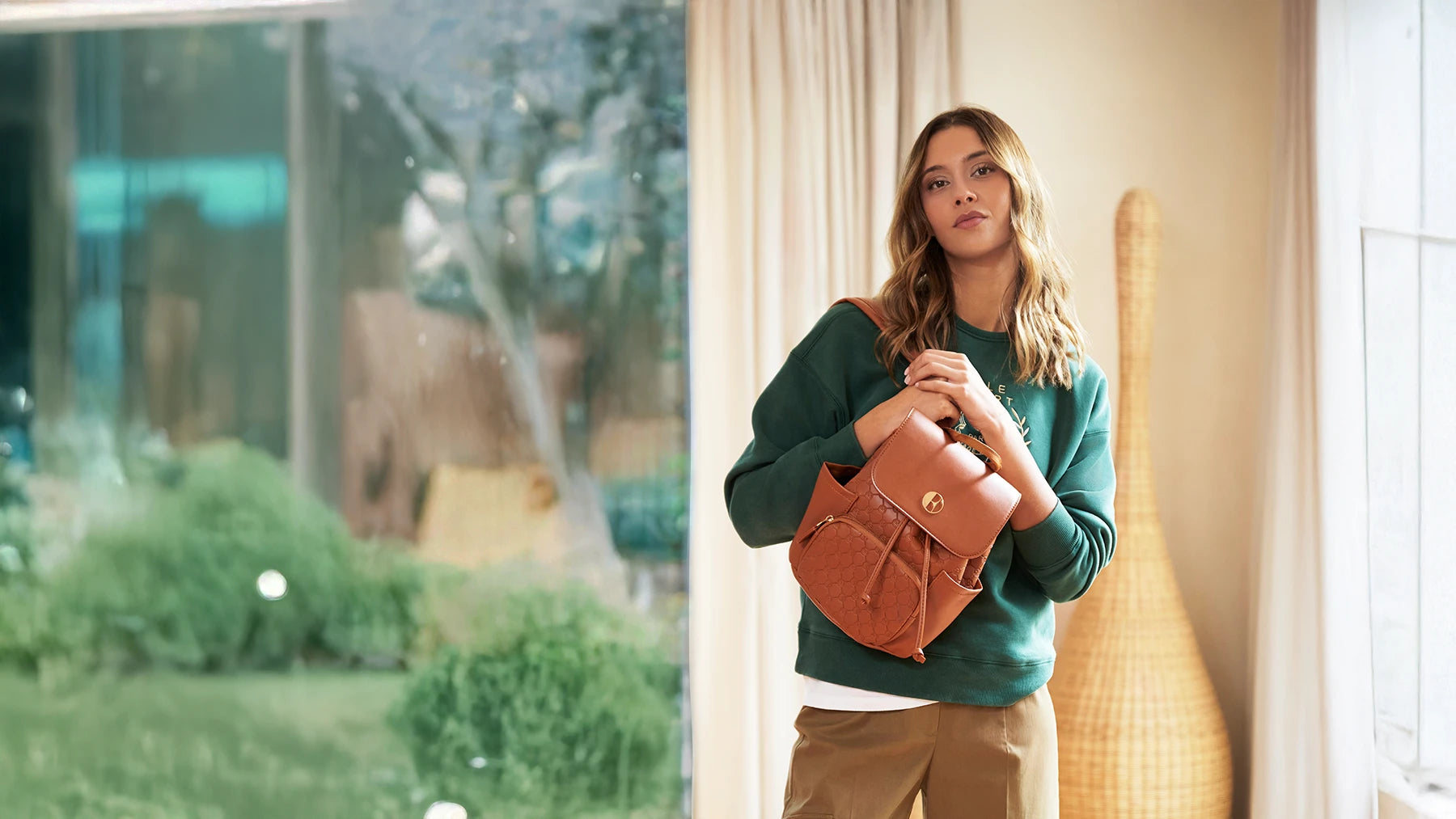 ELLE Compass Mini Backpack used by a woman