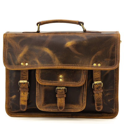 Brown leather satchel bag with visible wear on a white background