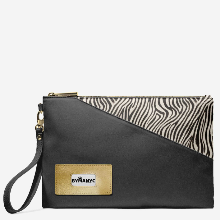 Black clutch bag with zebra print section and brand label on a white background