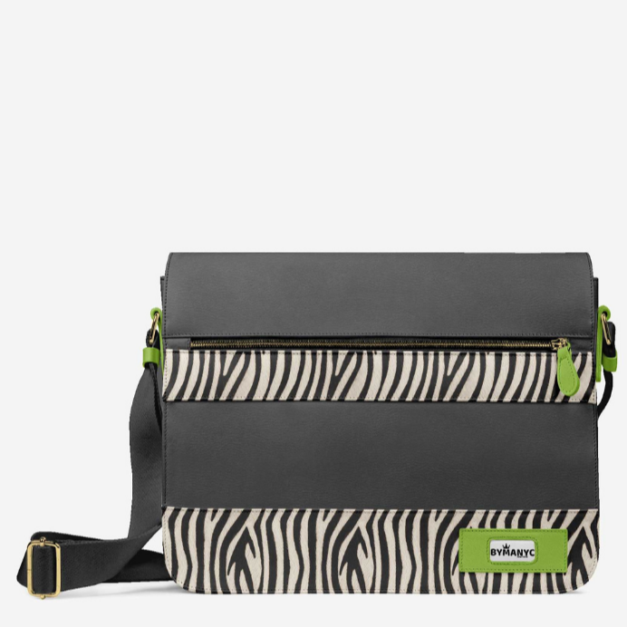 Black crossbody bag with zebra pattern and green accents on a white background