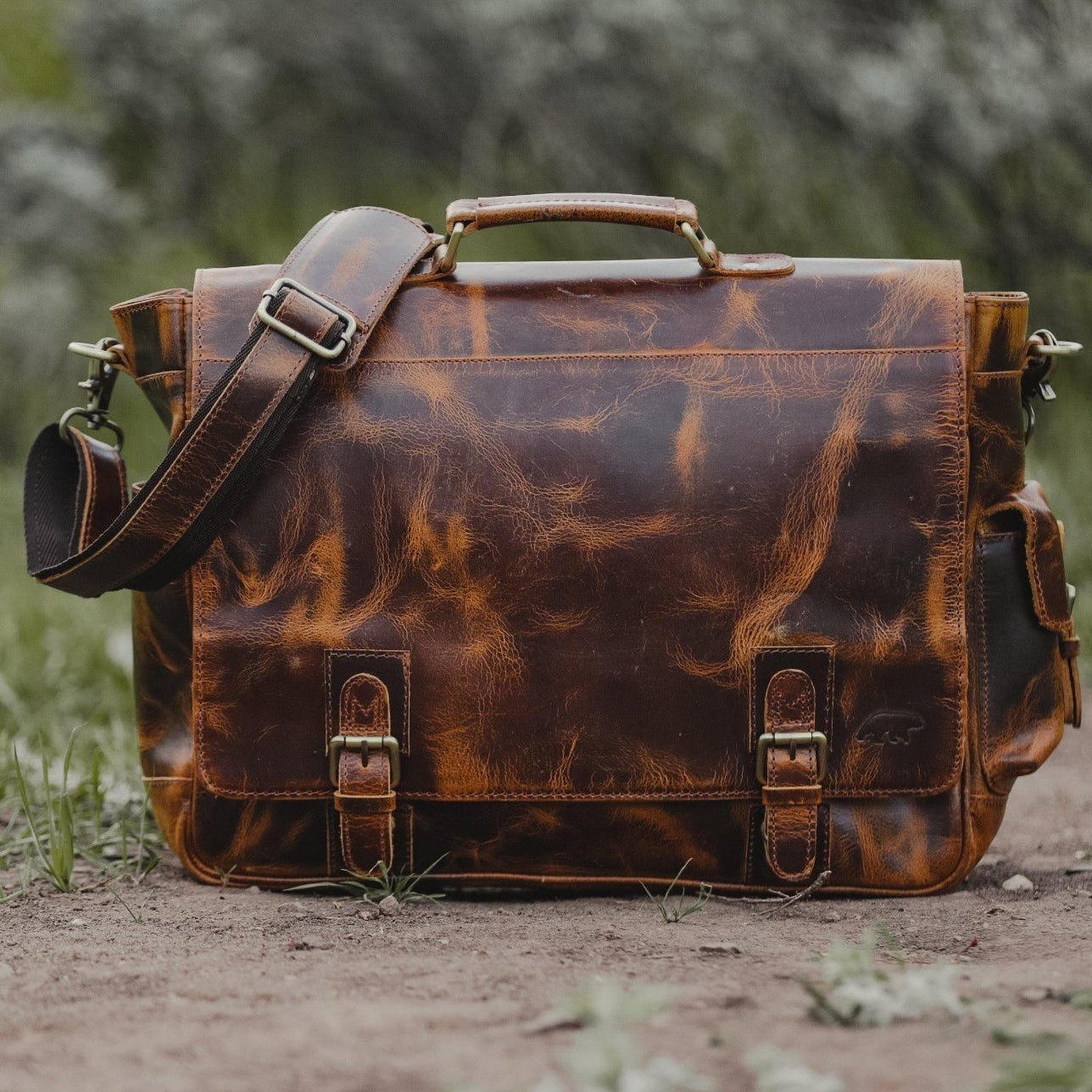 Brown leather satchel bag on a natural background