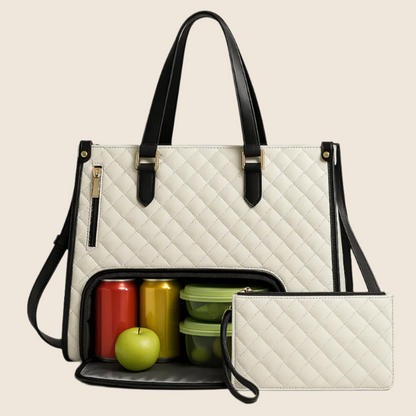 White quilted handbag with black accents containing colorful containers and a green apple on a beige background