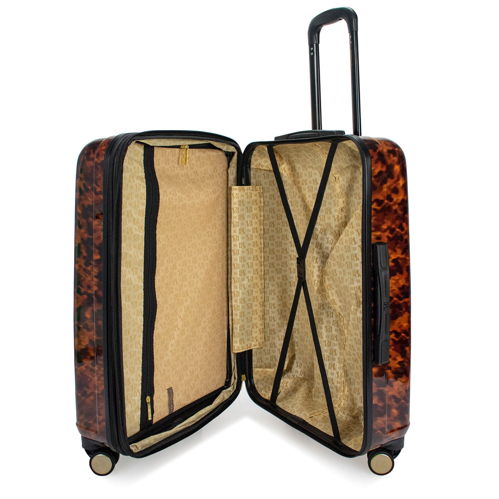 tortoise pattern luggage open with clothing storage compartment 