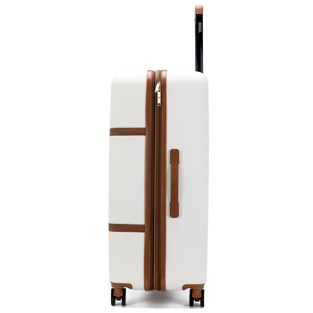 retro white luggage with brown accents and 360 degree spinning wheels by badgley mischka