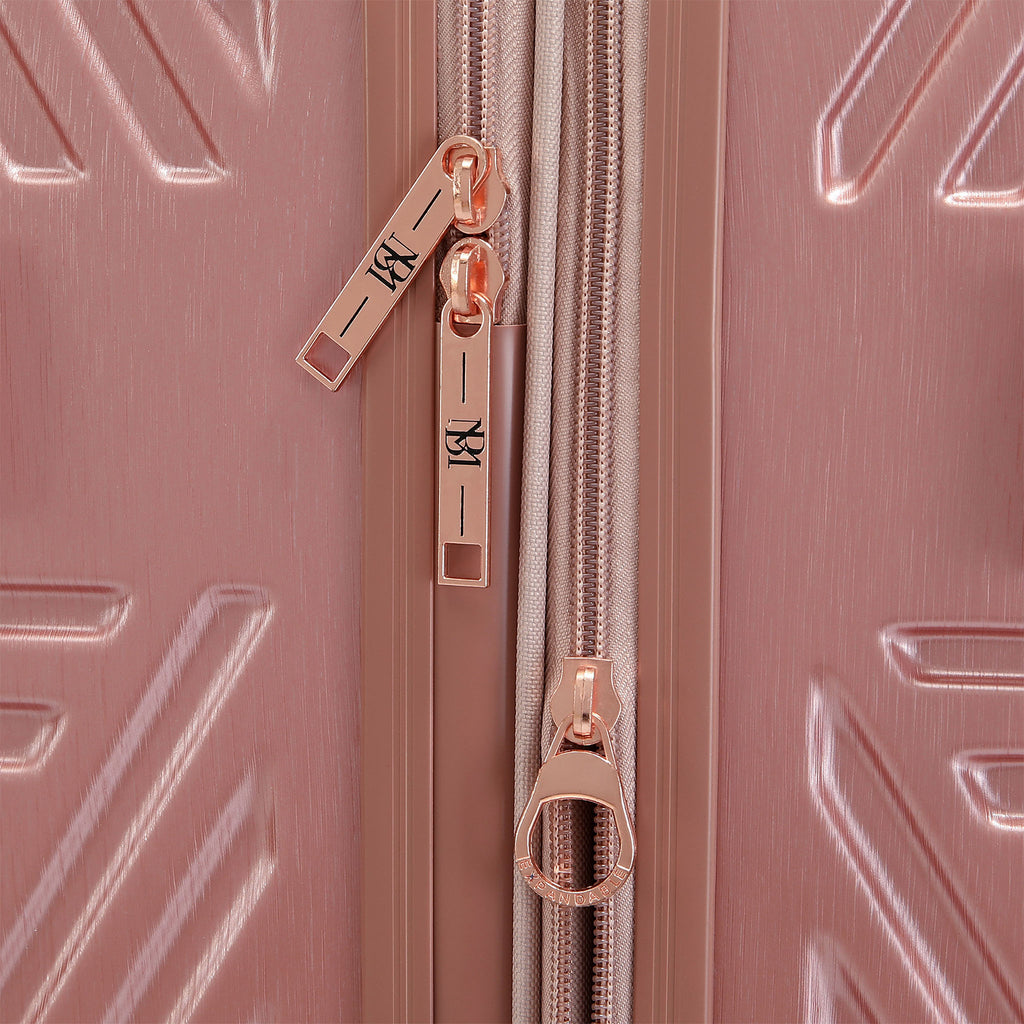 pink luggage with rose gold zippers and expandable zipper option
