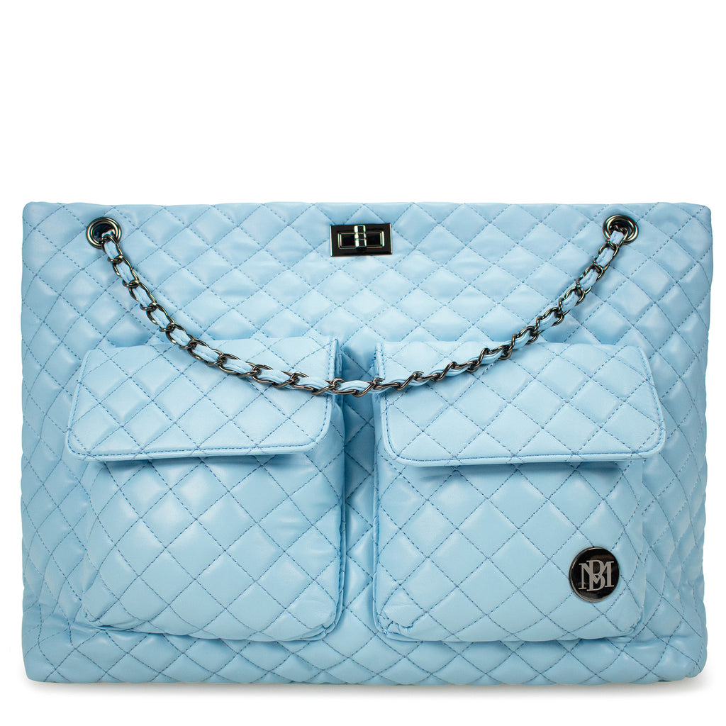 blue women's bag with quilted pattern by badgley mischka