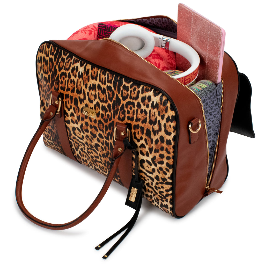 Saffiano leather leopard print bag with everyday items inside