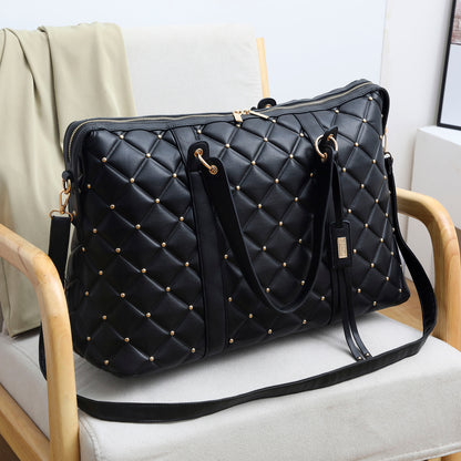 black vegan leather quilted weekender bag by badgley mischka