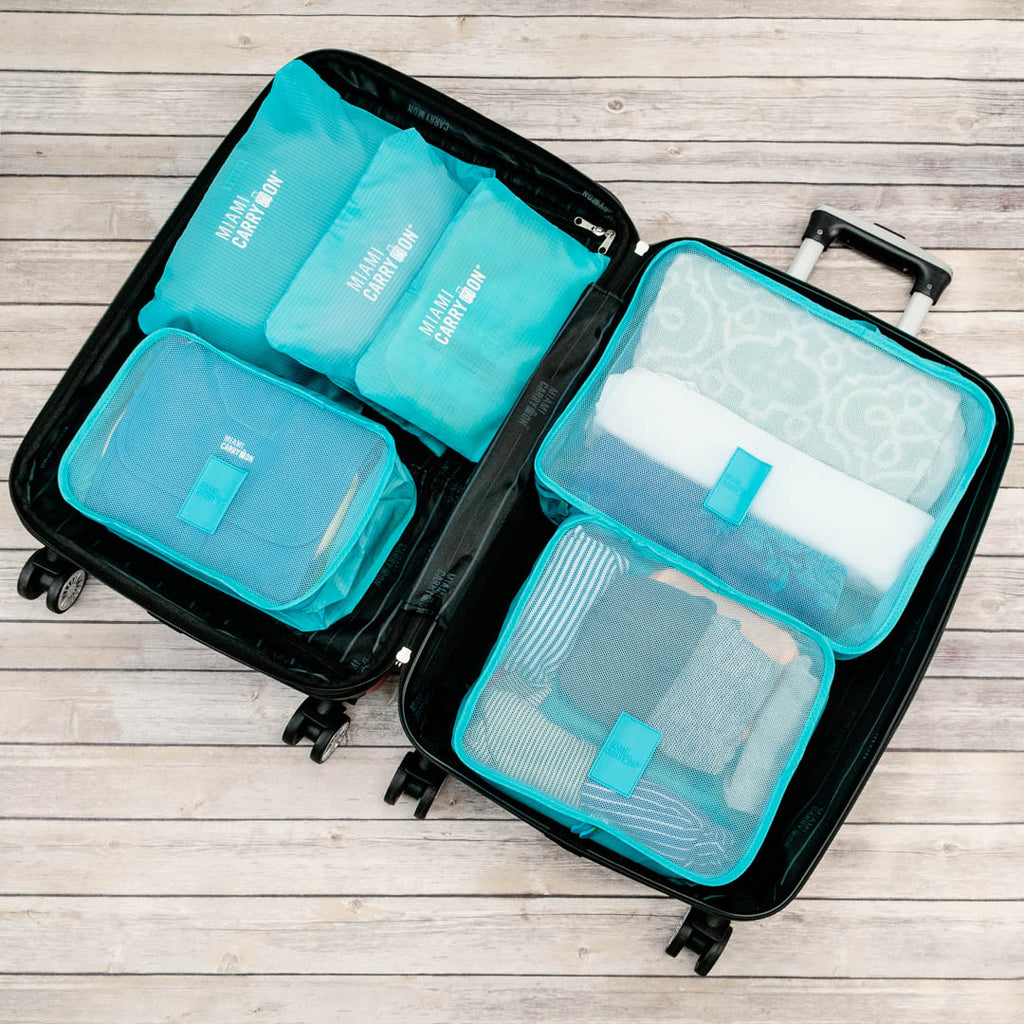 bright blue packing cubes in a luggage piece