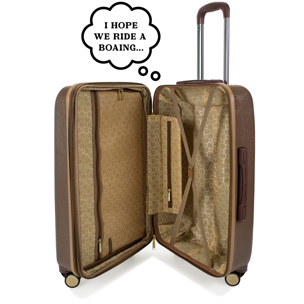 snakeskin luggage with a thought bubble that says "i hope we ride a boaing..."